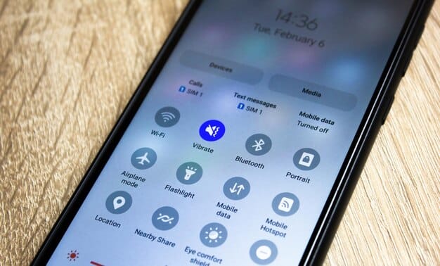 A close-up of a mobile phone displaying various digital wallet apps, with icons for Apple Pay, Google Pay, and Samsung Pay clearly visible.