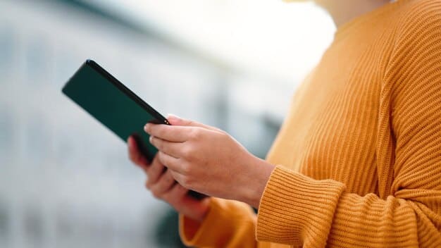 A close-up shot of a hand holding a smartphone with a mobile banking app open. The background features a diverse urban environment, symbolizing the broad reach and accessibility of digital payment solutions.