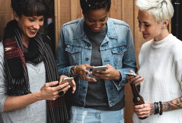 A representation of a diverse group of people using smartphones to make payments with CBDCs, symbolizing financial inclusion.