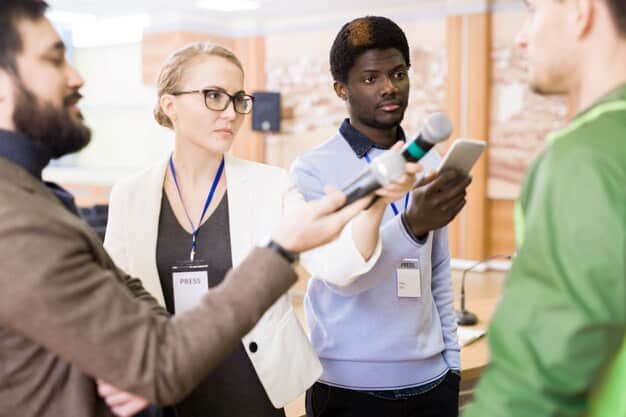 A diverse group of people networking at a fintech conference, showcasing the importance of building connections and relationships in the industry. The image should convey a sense of energy and collaboration.