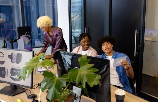 A diverse team of young professionals collaborating in a modern office, surrounded by computer screens displaying lines of code and financial data visualizations. They are brainstorming ideas for a new fintech payment solution, illustrating innovation and teamwork.