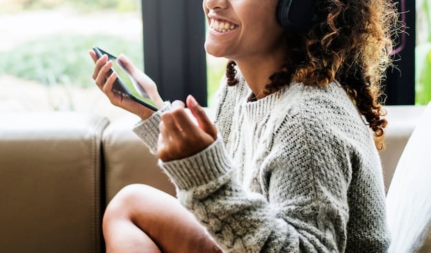 A user engaging with a mobile banking app on their smartphone, their finger tapping on a confirmation button for a payment. The surrounding environment is a modern cafe, suggesting everyday use and convenience.