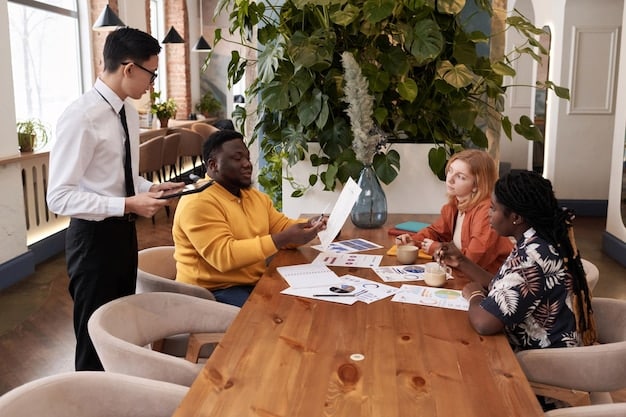 A diverse group of people collaborating around a table in a modern office space, with laptops and tablets displaying data analytics dashboards. The image conveys a sense of teamwork and data-driven decision-making.